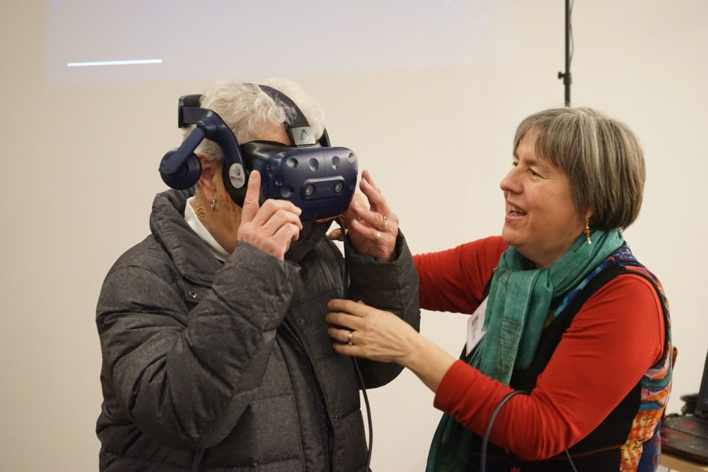 older woman experiencing VR at the Artist Showcase at Brookview