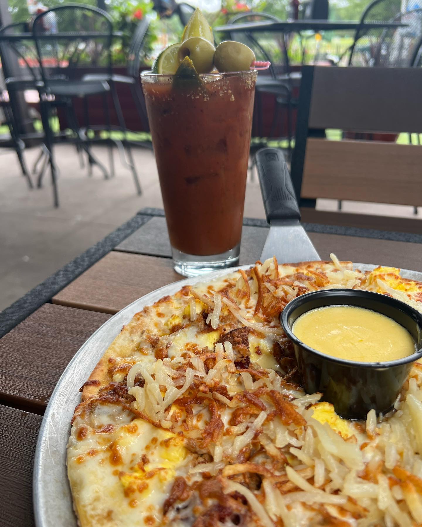 Breakfast pizza with a bloody mary