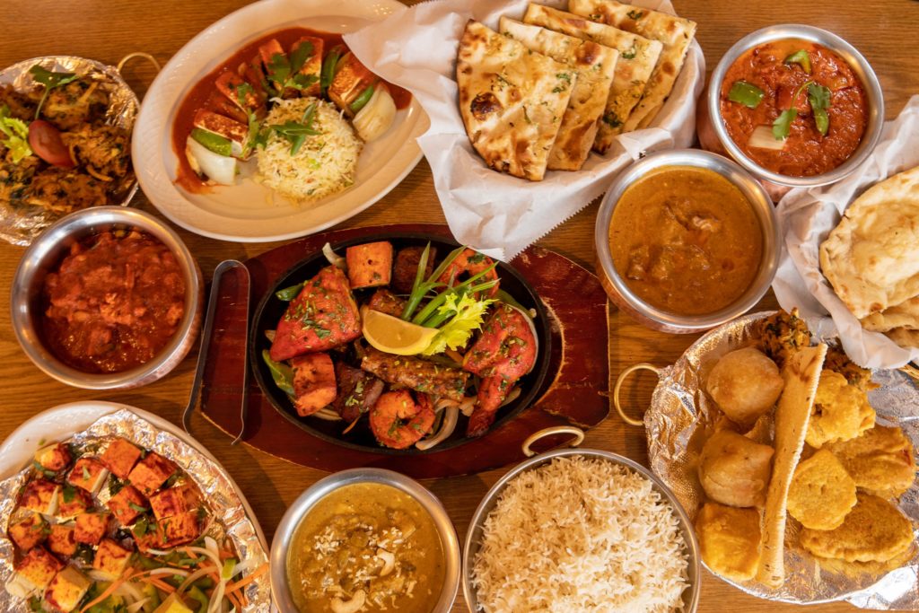 A table covered with Indian dishes