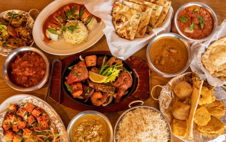 A table covered with Indian dishes