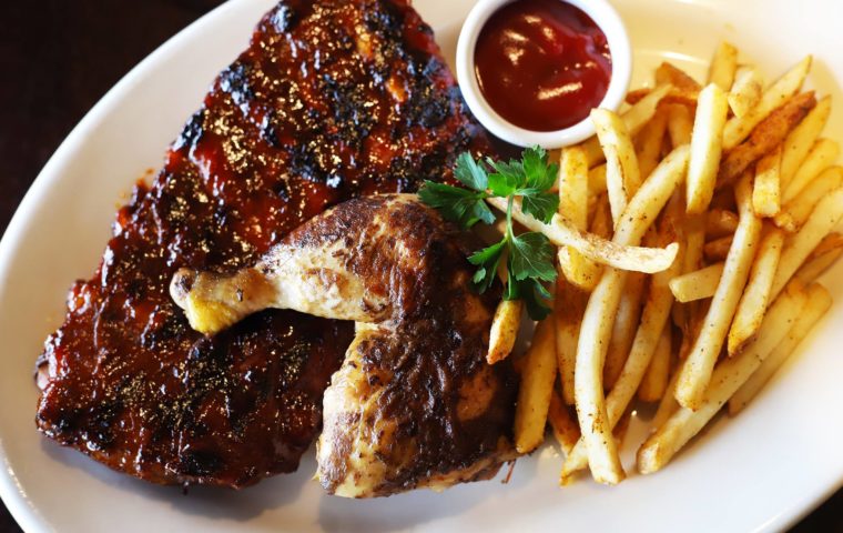 rotisserie chicken and ribs with French fries