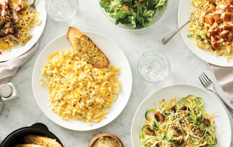 Variety of noodle dishes like mac & cheese, plus salad and bread