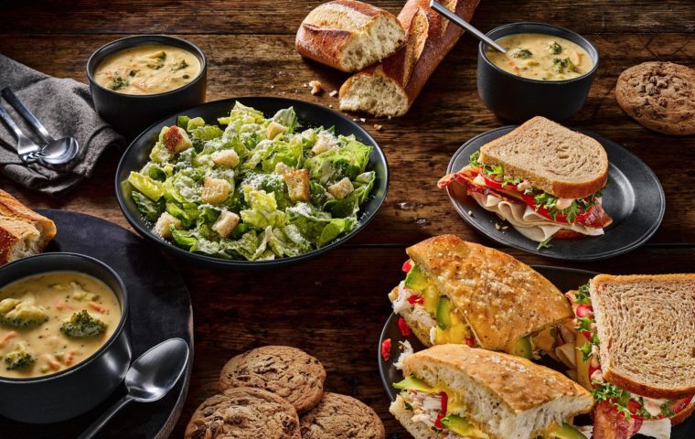 array of sandwiches, salads, soup and cookies