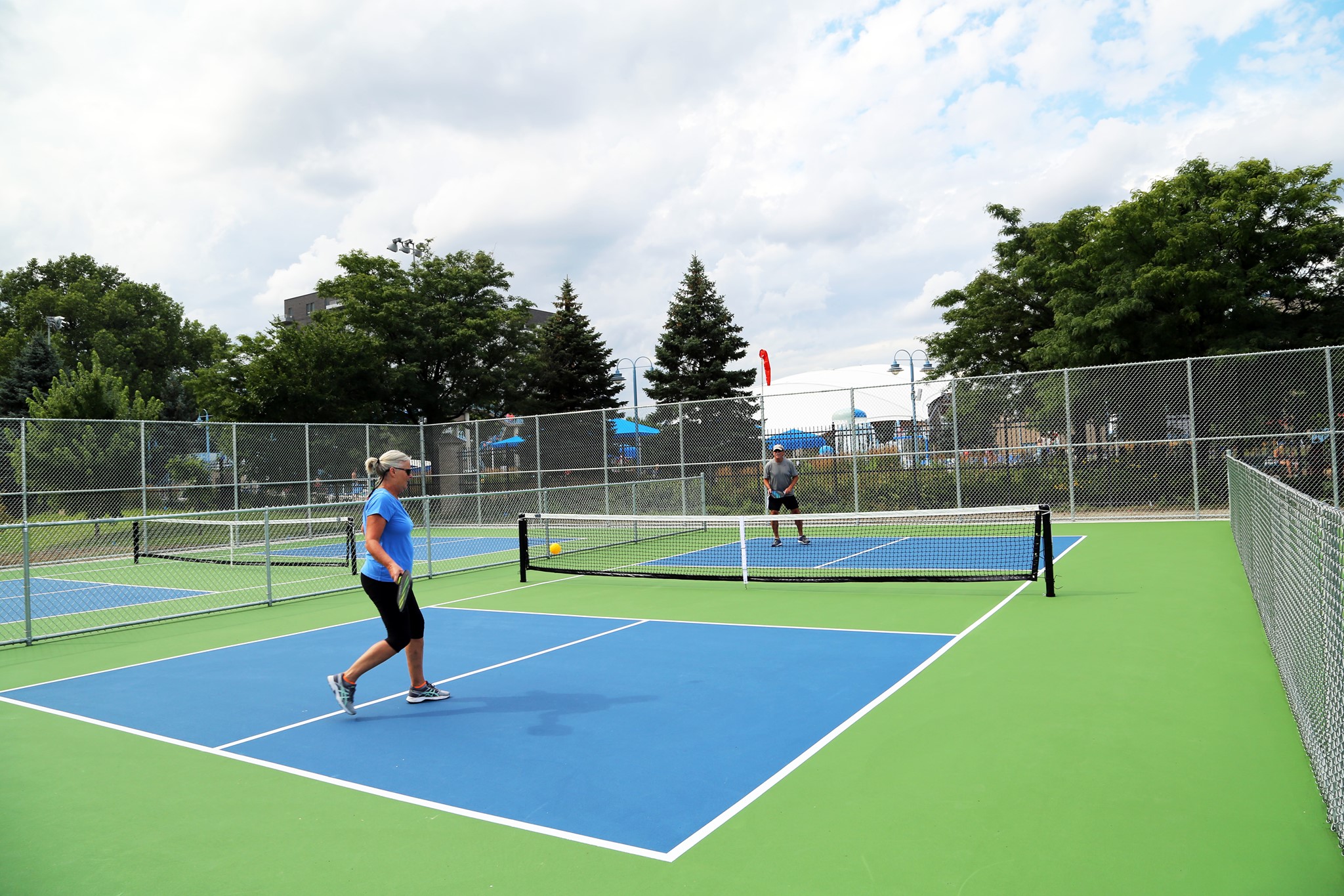 two people playing pickleball