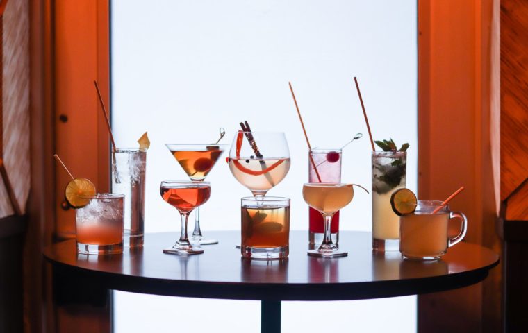 table filled with a variety of cocktails