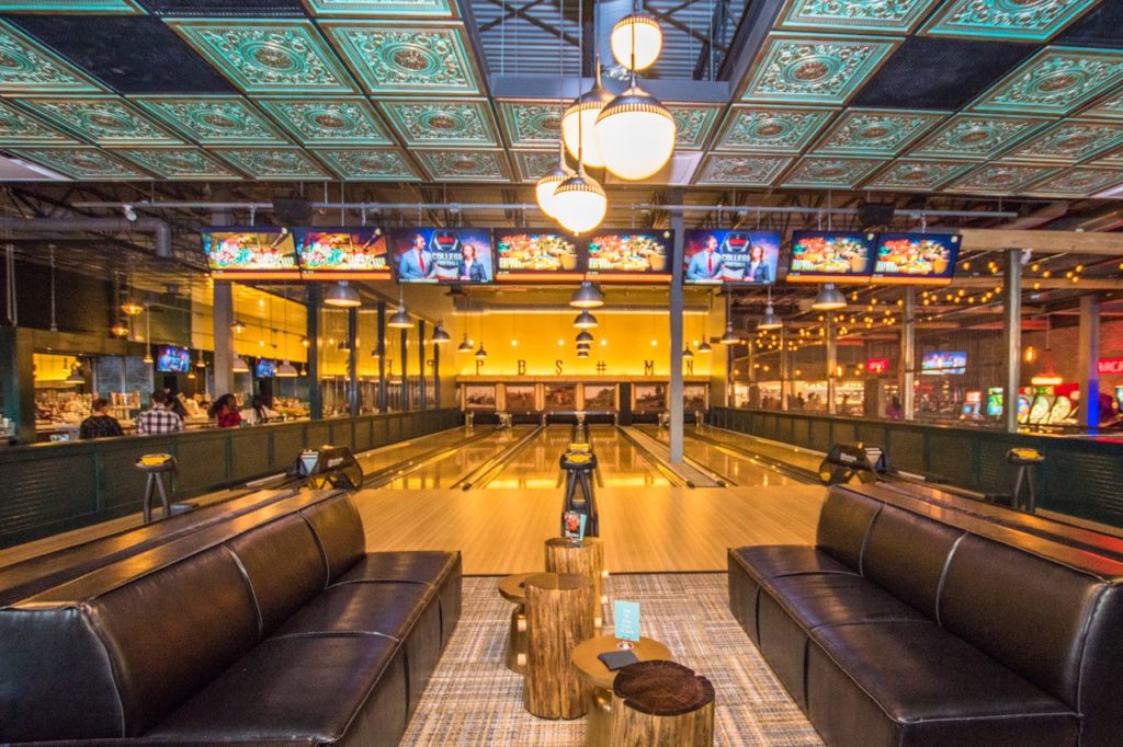 bowling area at Punch Bowl Social with TV screens