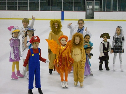 kids in costume ice skating