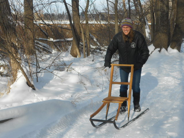 staff member with kicksled