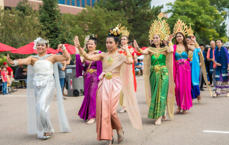 Women dressed in traditional Thai clothing taking part in a parade
