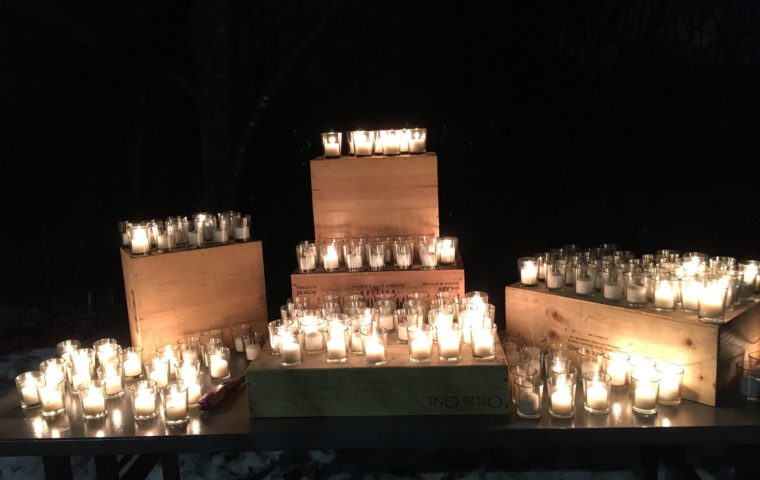 Display of candles lighting up the darkness