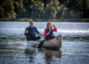 a couple canoeing on Westwood Lake