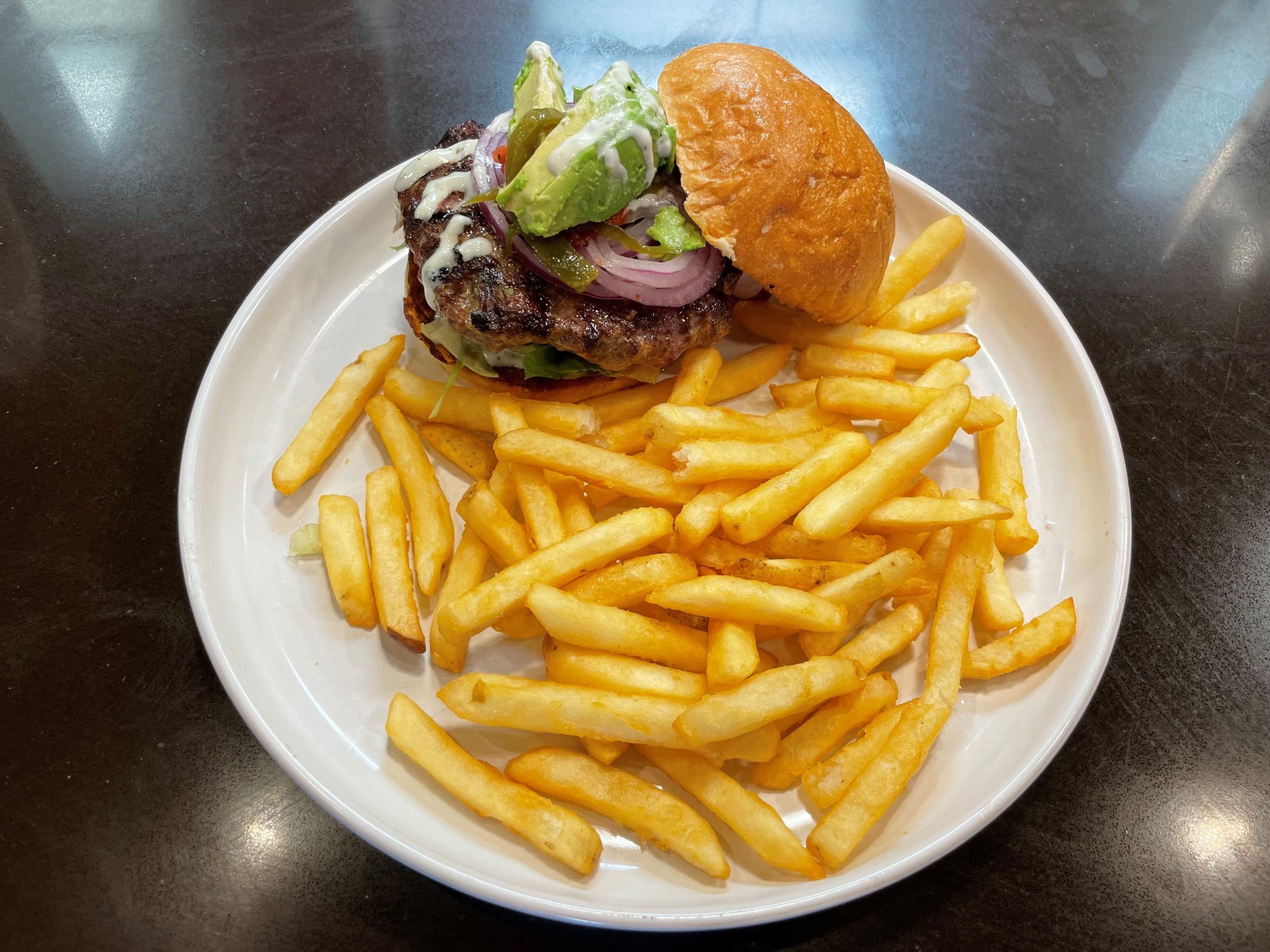 Bistro burger with avocado and french fries