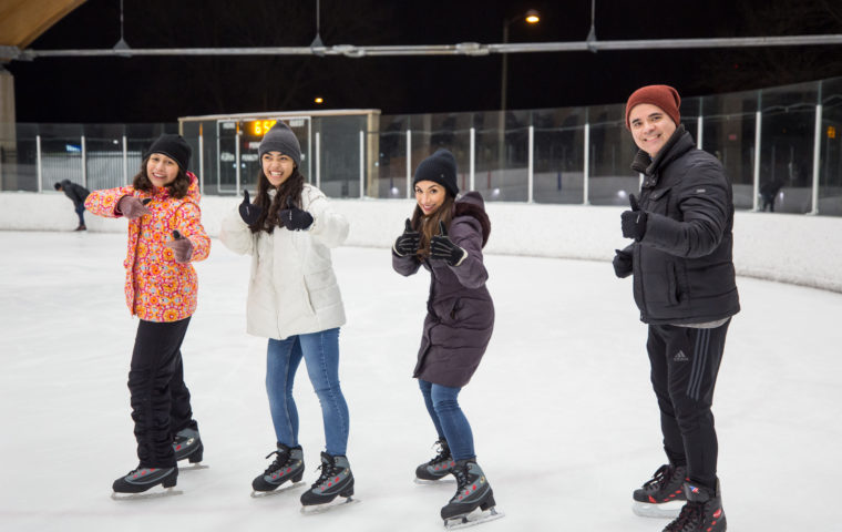 A family ice skating at the ROC in St. Louis Park