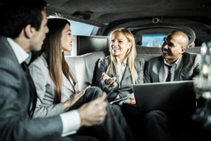 A group of business people in a limo
